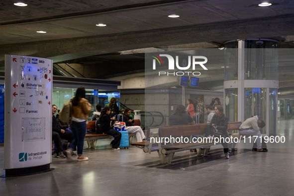 Several people wait for a train in one of the halls of Oriente railway station in Lisbon, Portugal, on October 28, 2024. Due to a growing sh...