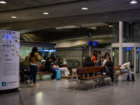 Several people wait for a train in one of the halls of Oriente railway station in Lisbon, Portugal, on October 28, 2024. Due to a growing sh...