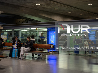 Several people wait for a train in one of the halls of Oriente railway station in Lisbon, Portugal, on October 28, 2024. Due to a growing sh...