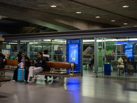 Several people wait for a train in one of the halls of Oriente railway station in Lisbon, Portugal, on October 28, 2024. Due to a growing sh...