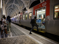 People board a train on one of the platforms at Oriente railway station in Lisbon, Portugal, on October 28, 2024. Due to a growing shortfall...