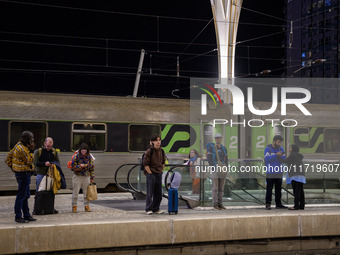 People gather on one of the platforms at Oriente train station in Lisbon, Portugal, on October 28, 2024. Due to a growing shortfall in benef...