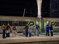 People gather on one of the platforms at Oriente train station in Lisbon, Portugal, on October 28, 2024. Due to a growing shortfall in benef...