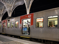 A person stands at the entrance of a train carriage waiting for departure at Oriente railway station in Lisbon, Portugal, on October 28, 202...