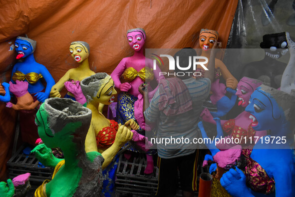 An artist makes figurines of demons ahead of Bhoot Chaturdashi, or Indian Halloween, in Kolkata, India, on October 29, 2024. 