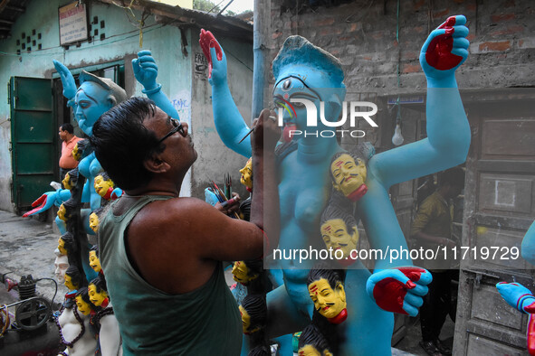 Artists make idols of Goddess Kali ahead of the Kali Puja and Diwali festival in Kolkata, India, on October 29, 2024. 