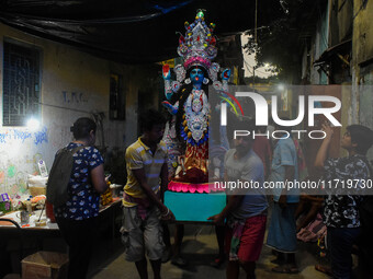 An idol of Goddess Kali is carried to pandals ahead of the Kali Puja and Diwali festival in Kolkata, India, on October 29, 2024. (