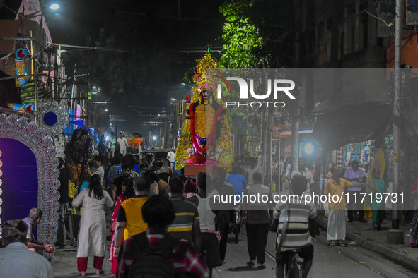 An idol of Goddess Kali is carried to pandals ahead of the Kali Puja and Diwali festival in Kolkata, India, on October 29, 2024. 