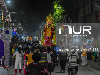 An idol of Goddess Kali is carried to pandals ahead of the Kali Puja and Diwali festival in Kolkata, India, on October 29, 2024. (