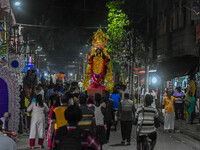 An idol of Goddess Kali is carried to pandals ahead of the Kali Puja and Diwali festival in Kolkata, India, on October 29, 2024. (