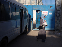 UN employees enter the United Nations Relief and Works Agency for Palestine Refugees (UNRWA) center in the Nuseirat refugee camp in central...