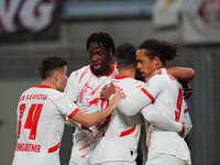 Yussuf Poulsen of Leipzig celebrates the teams first goal during the DFB Cup  Second Round match between RB Leipzig and FC St. Pauli at Red...