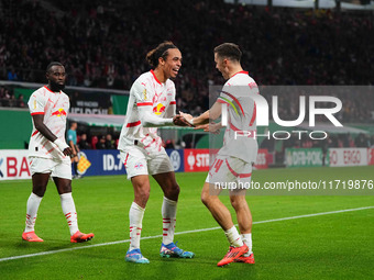 Yussuf Poulsen of Leipzig celebrates the teams third goal during the DFB Cup  Second Round match between RB Leipzig and FC St. Pauli at Red...