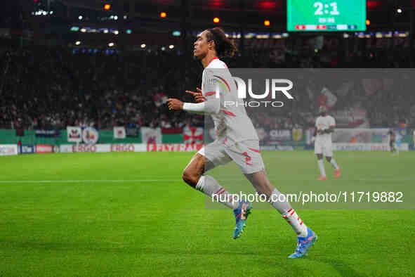 Yussuf Poulsen of Leipzig celebrates the teams third goal during the DFB Cup  Second Round match between RB Leipzig and FC St. Pauli at Red...