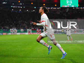 Yussuf Poulsen of Leipzig celebrates the teams third goal during the DFB Cup  Second Round match between RB Leipzig and FC St. Pauli at Red...