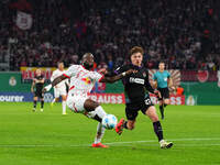 El Chadaille Bitshiabu of Leipzig controls the ball during the DFB Cup  Second Round match between RB Leipzig and FC St. Pauli at Red Bull a...