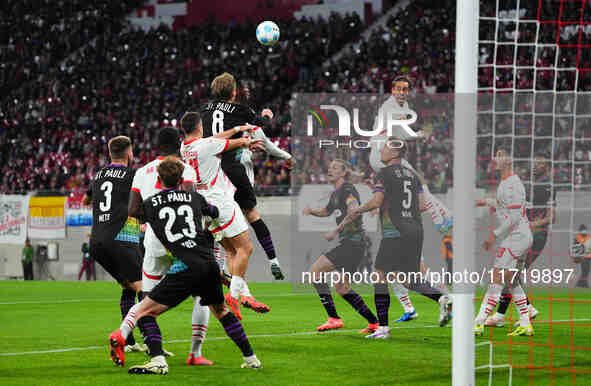 El Chadaille Bitshiabu of Leipzig heads during the DFB Cup  Second Round match between RB Leipzig and FC St. Pauli at Red Bull arena, Leipzi...