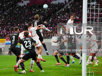 El Chadaille Bitshiabu of Leipzig heads during the DFB Cup  Second Round match between RB Leipzig and FC St. Pauli at Red Bull arena, Leipzi...