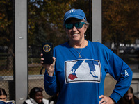 Linda Moore of Reston, VA, displays her shirt and hat supporting Vice President Kamala Harris while waiting to enter the Ellipse for a rally...