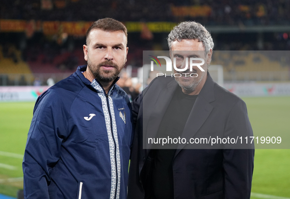 Luca Gotti, head coach of US Lecce, is with Paolo Zanetti, head coach of Hellas Verona, during the Serie A match between Lecce and Verona in...