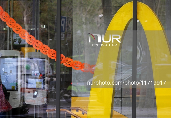 A McDonald's branch in the commercial area of Barcelona, Spain, on October 29, 2024, has Halloween decorations on its windows. 