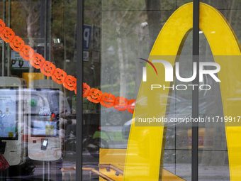 A McDonald's branch in the commercial area of Barcelona, Spain, on October 29, 2024, has Halloween decorations on its windows. (