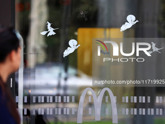 A McDonald's branch in the commercial area of Barcelona, Spain, on October 29, 2024, has Halloween decorations on its windows. (