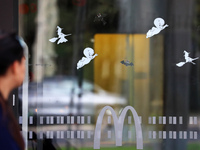 A McDonald's branch in the commercial area of Barcelona, Spain, on October 29, 2024, has Halloween decorations on its windows. (