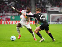 El Chadaille Bitshiabu of Leipzig controls the ball during the DFB Cup  Second Round match between RB Leipzig and FC St. Pauli at Red Bull a...