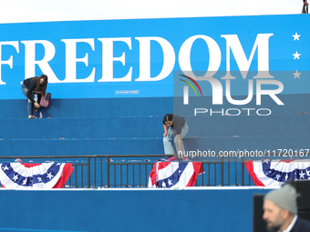 Volunteers make final preparations for a campaign rally for Vice President Kamala Harris on the Ellipse in Washington, D.C. on October 29, 2...