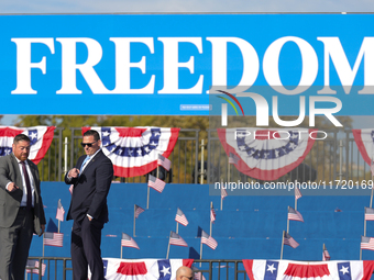 U.S. Secret Service officers make final preparations for a campaign rally for Vice President Kamala Harris on the Ellipse in Washington, D.C...