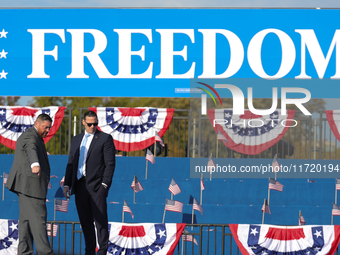 U.S. Secret Service officers make final preparations for a campaign rally for Vice President Kamala Harris on the Ellipse in Washington, D.C...