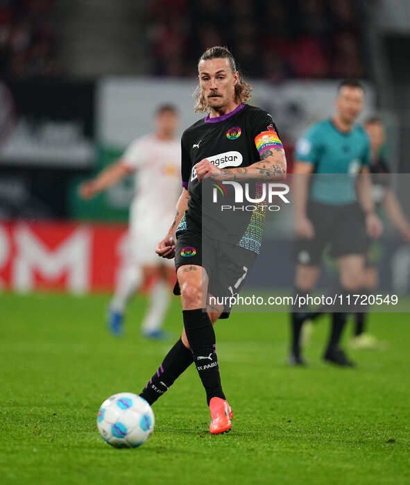 Jackson Irvine of FC St. Pauli controls the ball during the DFB Cup  Second Round match between RB Leipzig and FC St. Pauli at Red Bull aren...