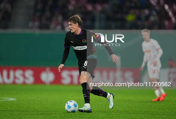 Eric Smith of FC St. Pauli controls the ball during the DFB Cup  Second Round match between RB Leipzig and FC St. Pauli at Red Bull arena, L...