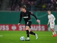 Eric Smith of FC St. Pauli controls the ball during the DFB Cup  Second Round match between RB Leipzig and FC St. Pauli at Red Bull arena, L...