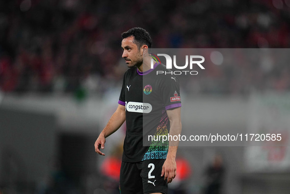 Manolis Saliakas of FC St. Pauli controls the ball during the DFB Cup  Second Round match between RB Leipzig and FC St. Pauli at Red Bull ar...