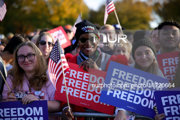 Supporters of Vice President Kamala Harris wait for a campaign rally to begin on the Ellipse in Washington, D.C. on October 29, 2024. 