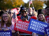 Supporters of Vice President Kamala Harris wait for a campaign rally to begin on the Ellipse in Washington, D.C. on October 29, 2024. (