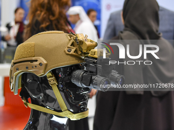 A photo shows a protective helmet with night vision goggles at the 15th edition of the Milipol Qatar 2024 Exhibition and Conference in Doha,...