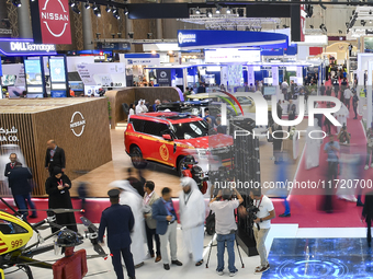 A general view shows people visiting after the opening ceremony of the 15th edition of the Milipol Qatar 2024 Exhibition and Conference in D...