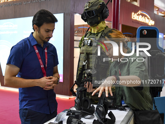 Visitors look at exhibits at the 15th edition of the Milipol Qatar 2024 Exhibition and Conference in Doha, Qatar, on October 29, 2024. The M...