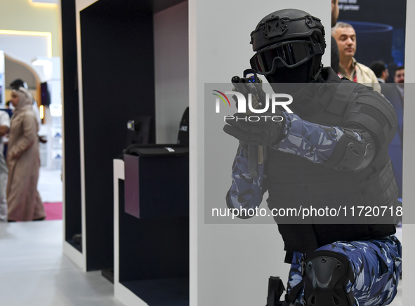 A mannequin holds an assault rifle and displays an urban combat uniform during the 15th edition of the Milipol Qatar 2024 Exhibition and Con...