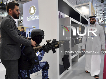 Visitors look at exhibits at the 15th edition of the Milipol Qatar 2024 Exhibition and Conference in Doha, Qatar, on October 29, 2024. The M...