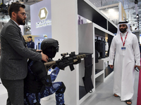 Visitors look at exhibits at the 15th edition of the Milipol Qatar 2024 Exhibition and Conference in Doha, Qatar, on October 29, 2024. The M...