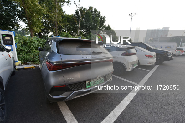 Electric vehicles are charged at a street charging station in Fuyang, China, on October 30, 2024. 