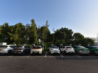 Electric vehicles are charged at a street charging station in Fuyang, China, on October 30, 2024. (