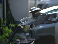 Electric vehicles are charged at a street charging station in Fuyang, China, on October 30, 2024. (