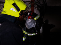 Firefighters try to douse the flames after a fire incident is reported in a commercial building in Srinagar, Jammu and Kashmir, India, on Oc...