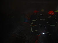 Firefighters try to douse the flames after a fire incident is reported in a commercial building in Srinagar, Jammu and Kashmir, India, on Oc...