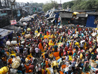 Vendors sell marigold garlands, which are used to decorate temples and homes ahead of the Diwali festival in Kolkata, India, on October 30,...